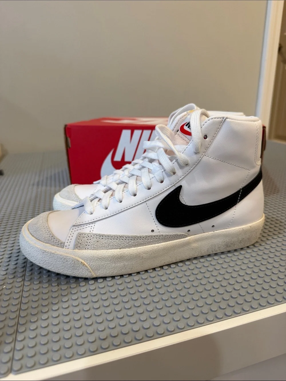 Nike White High-Top Sneakers with Black Swoosh